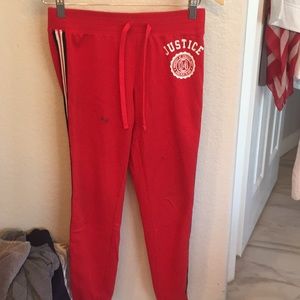 Red justice track pants